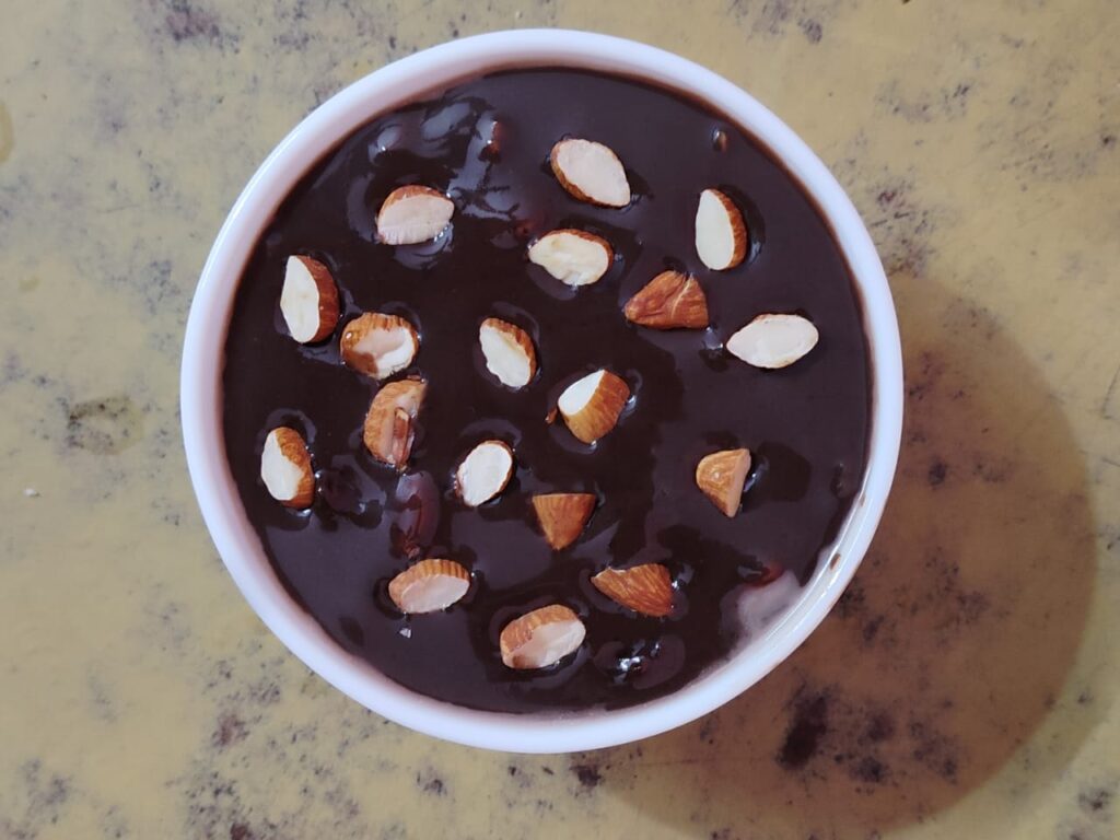 Easy 100% Eggless Chocolate Fudge Sauce (Rich & Glossy) 1 homemade chocolate fudge sauce with roasted almonds